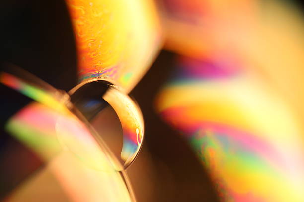 istock Green reflections of liquid in macro, bright liquid surface on black background, geometric shapes 2216075459