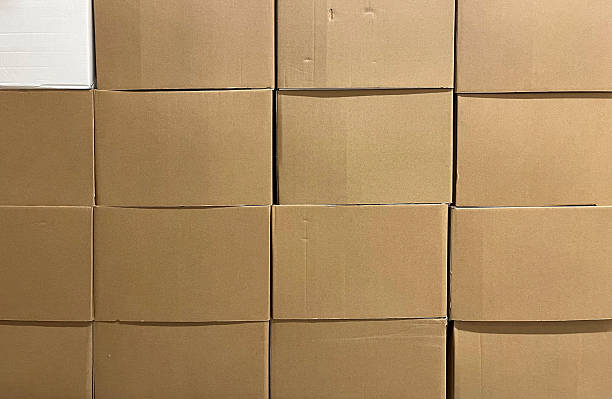 istock Stacked brown parcel box background, eco delivery 2216075973