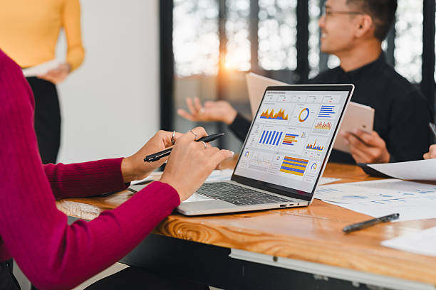 istock Data analysis meeting with business team using laptop and digital chart for project planning and strategy in modern office environment 2216076396
