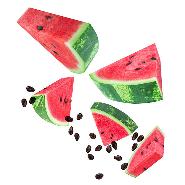 istock Levitating Watermelon triangle slices isolated on white. Watermelon explocion. Flying   watermelon fruit pieces with seeds. Pattern. Summer Creative layout 2216077413