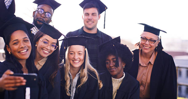 istock Smiling Group of Diverse Graduates Taking a Selfie During a Joyful Graduation Celebration 2216077611