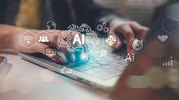 istock Close-up of hands typing on laptop with glowing AI icons and digital technology interface, symbolizing artificial intelligence, automation, machine learning, and smart business solutions. 2216077706