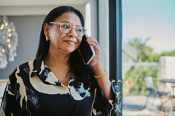 istock Confident Mature Woman Talking on Smartphone 2216078550