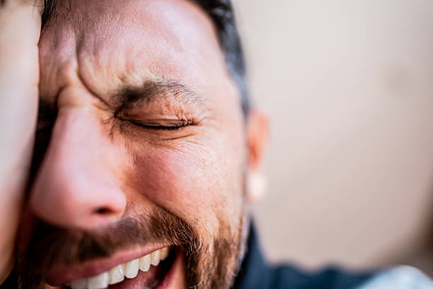 Close up Portrait of a Happy Mature Man Laughing