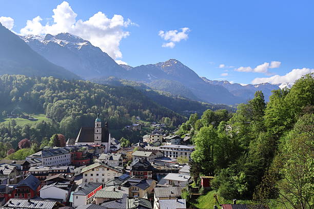 istock Berchtesgaden rooftops and church with mountains in spring, Bavaria, Germany. 2216079751