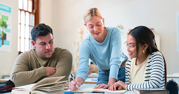Group of College Students Collaborating Together During a Study Session in a Bright Classroom