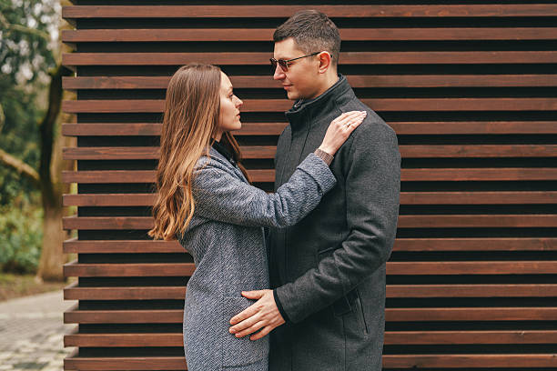 istock Couple enjoying a tender moment outdoors in a modern urban setting during a sunny day 2216082645
