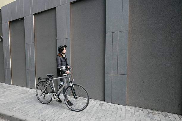 istock Woman riding a bicycle in a city 2216083963