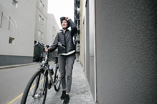 istock Woman riding a bicycle in a city 2216083989