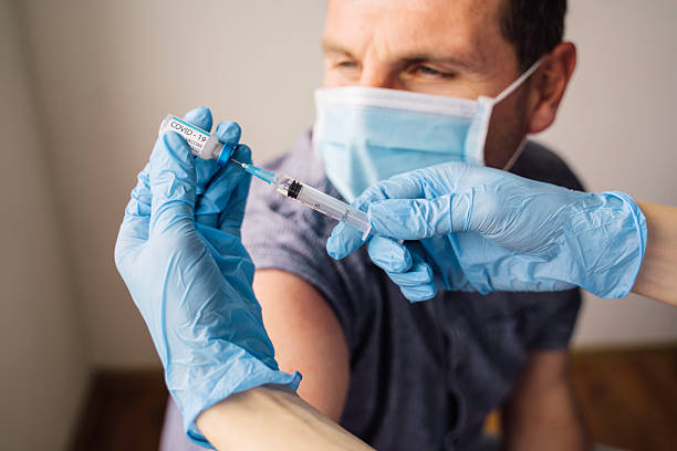 istock Close-up of vaccine preparation and injection process 2216084703
