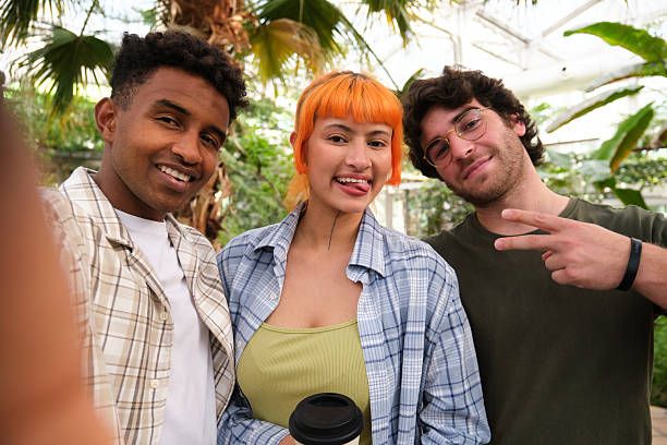 istock Three young friends taking a selfie in a greenhouse 2216085835