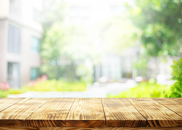 istock Selective focus.wooden tabletop with a bright, natural garden background.For home environment concepts 2216087260