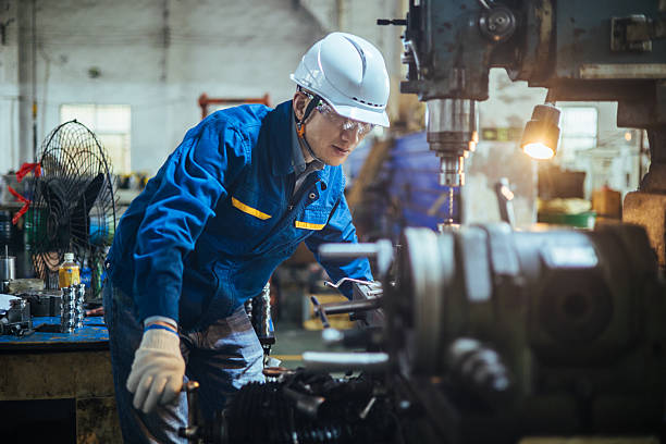 istock Asian male engineer working on lathe 2216087358