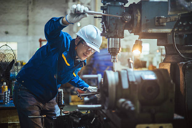 istock Asian male engineer working on lathe 2216087377