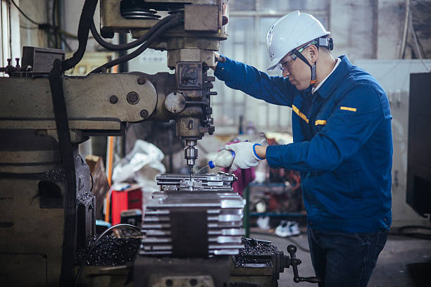 istock Asian male engineer working on lathe 2216087569