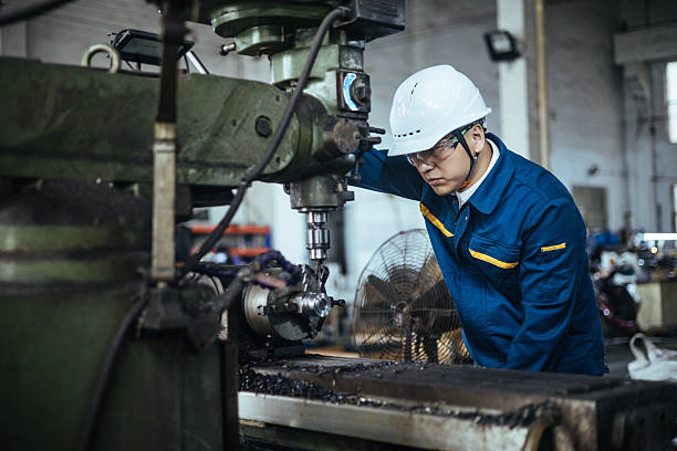 istock Asian male engineer working on lathe 2216087587