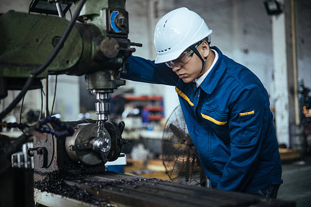 istock Asian male engineer working on lathe 2216087611