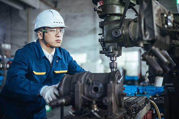 istock Asian male engineer working on lathe 2216087612