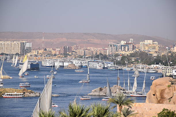 Sail boats, Felucca and river cruisers congregate in the busy harbour of Aswan. Egyptian sailing port