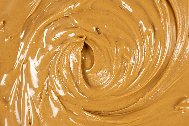 istock Creamy Texture American Natural Peanut Butter Top View Macro 2216091228