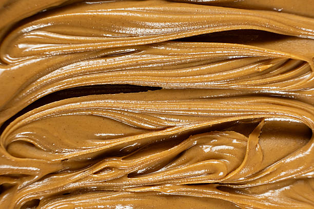 istock Creamy Texture American Natural Peanut Butter Top View Macro 2216091245