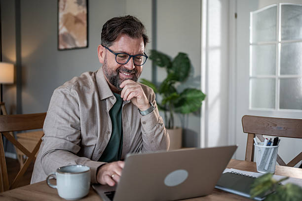 istock Mid adult man working from home office 2216091822