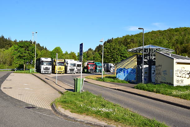 Mehring, Germany - April/29/2025: Autobahn parking lot Mehring near Trier, A1 route, truck filled parking