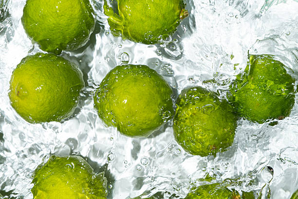 istock Fresh Whole Limes Floating in Water Top View 2216092144
