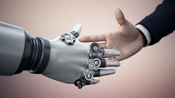 istock Human and robotic hand shake symbolizing collaboration in technology and innovation for a better future 2216092825