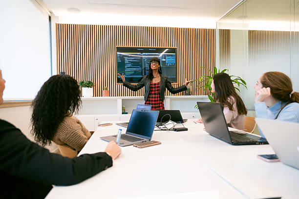 istock Transgender business woman giving a presentation about Machine learning and Artificial Intelligence 2216093300
