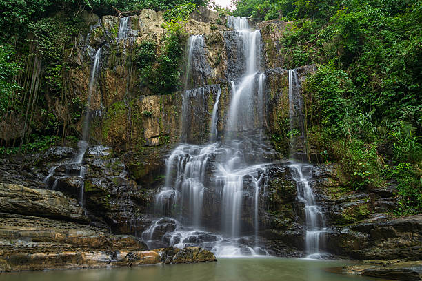 istock Beautiful waterfall in the green forest 2216096132
