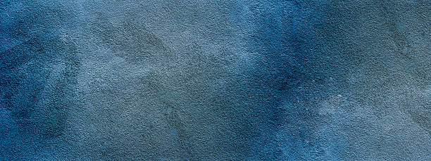 Blue colored abstract stone concrete wall plaster facade cement tile texture background panorama banner long