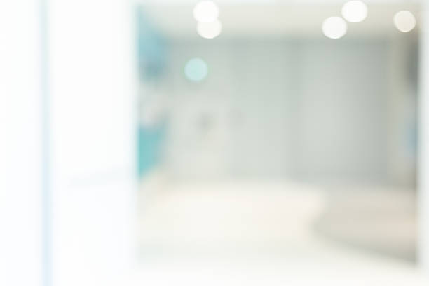 istock Abstract blurred workplace interior with modern glass window reflective background ; loft style contemporary design of lounge or lobby for presentation and design as banner and ads 2216097851