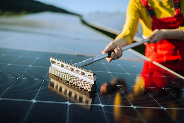 istock Close up of  cleaning solar panels. 2216098952