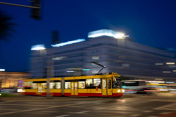 Old town at night with motion blur tram, Warsaw