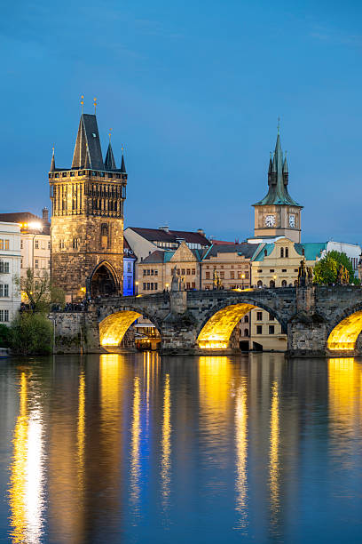 istock View across river to old town and bridge at dusk, Prague 2216099991