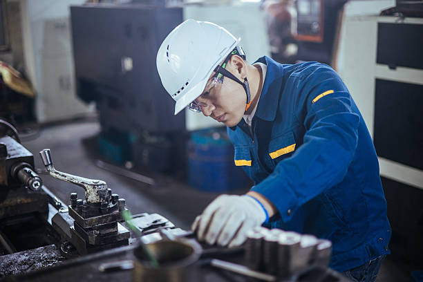 istock Asian male engineer working on lathe 2216101233