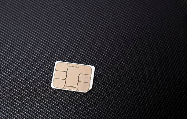 istock small nano sim card isolated on white background. Selective focus. 2216101540