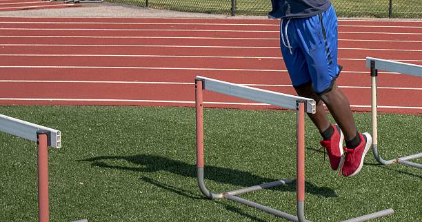 istock Athlete Performs Hurdle Training on Track Field in Sunny Weather 2216106979