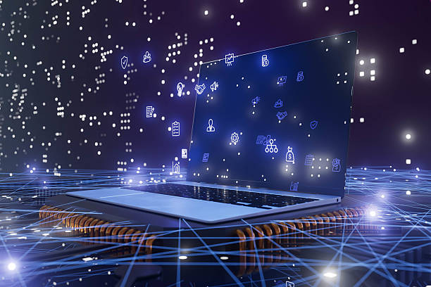 istock A laptop is on a table with a blue screen that has a lot of dots on it and business icon 2216107607