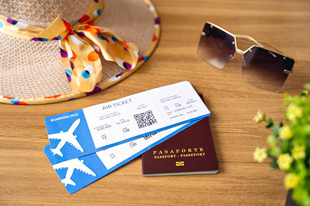 istock Colombian passport and plane tickets on table. 2216108400