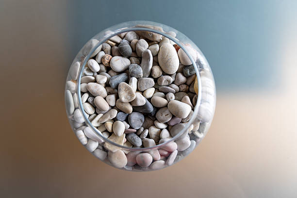 Small smoke stones scattered on a white surface