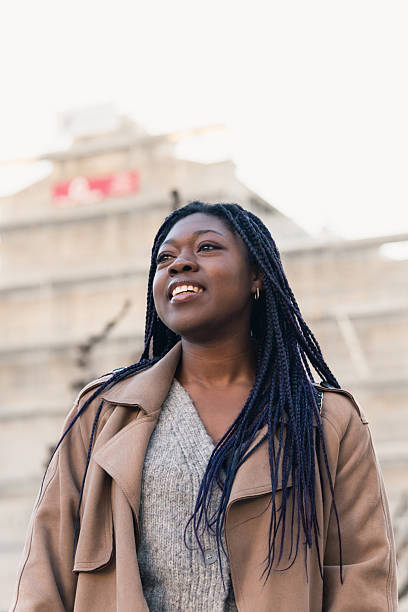 istock Smiling woman enjoying outdoor urban setting 2216113010