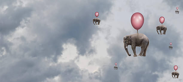 Elephants are seen floating gently in a cloudy sky, each one attached to a colorful balloon. The whimsical sight creates a surreal atmosphere reminiscent of dreams or fantasies.