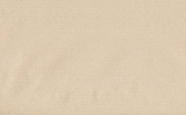 Recycled beige paper, background or cardboard.