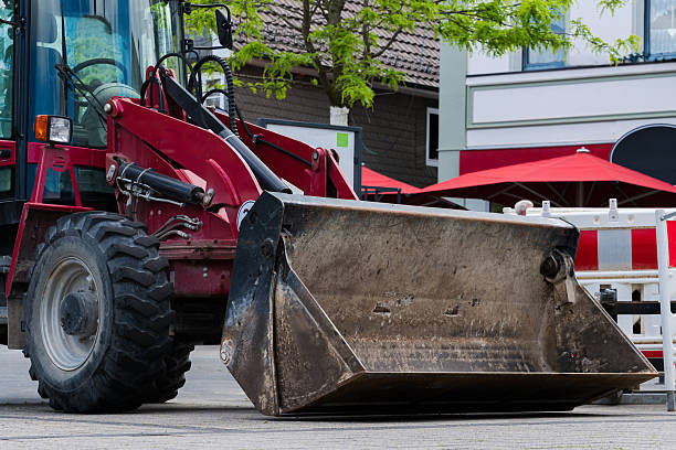 istock A large red loader prepares for roadwork in urban area 2216115951