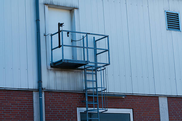 istock Metal stairway leading to elevated platform on building exterior 2216116385
