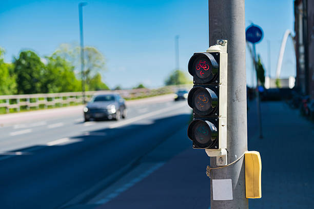 istock Traffic light signals along a busy road on a clear day 2216116682