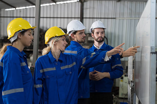 istock Engineer team, Group of colleagues or Workers meeting, discuss, training and present of work on whiteboard in factory 2216116763