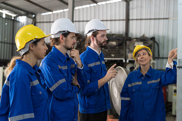 istock Engineer team, Group of colleagues or Workers meeting, discuss, training and present of work on whiteboard in factory 2216116767